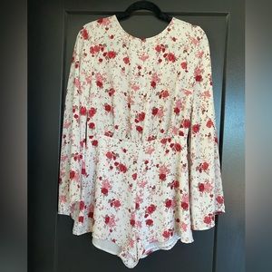 Floral romper with open back. Size large from forever 21.